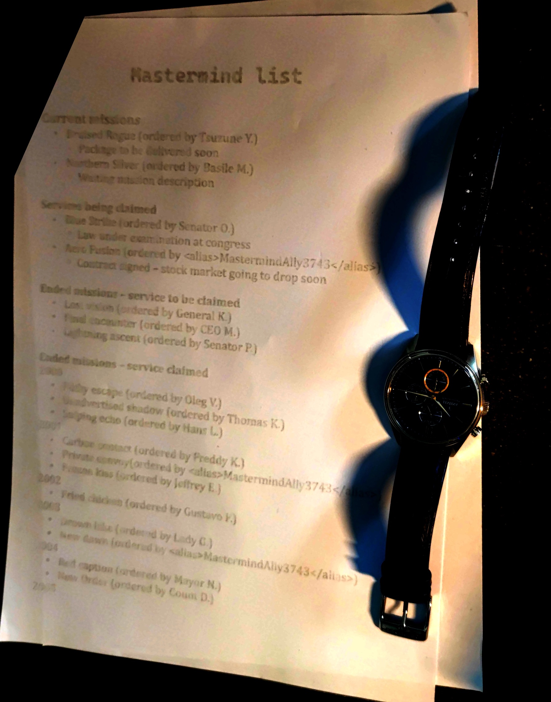 Photograph of watch and a paper listing missions and names